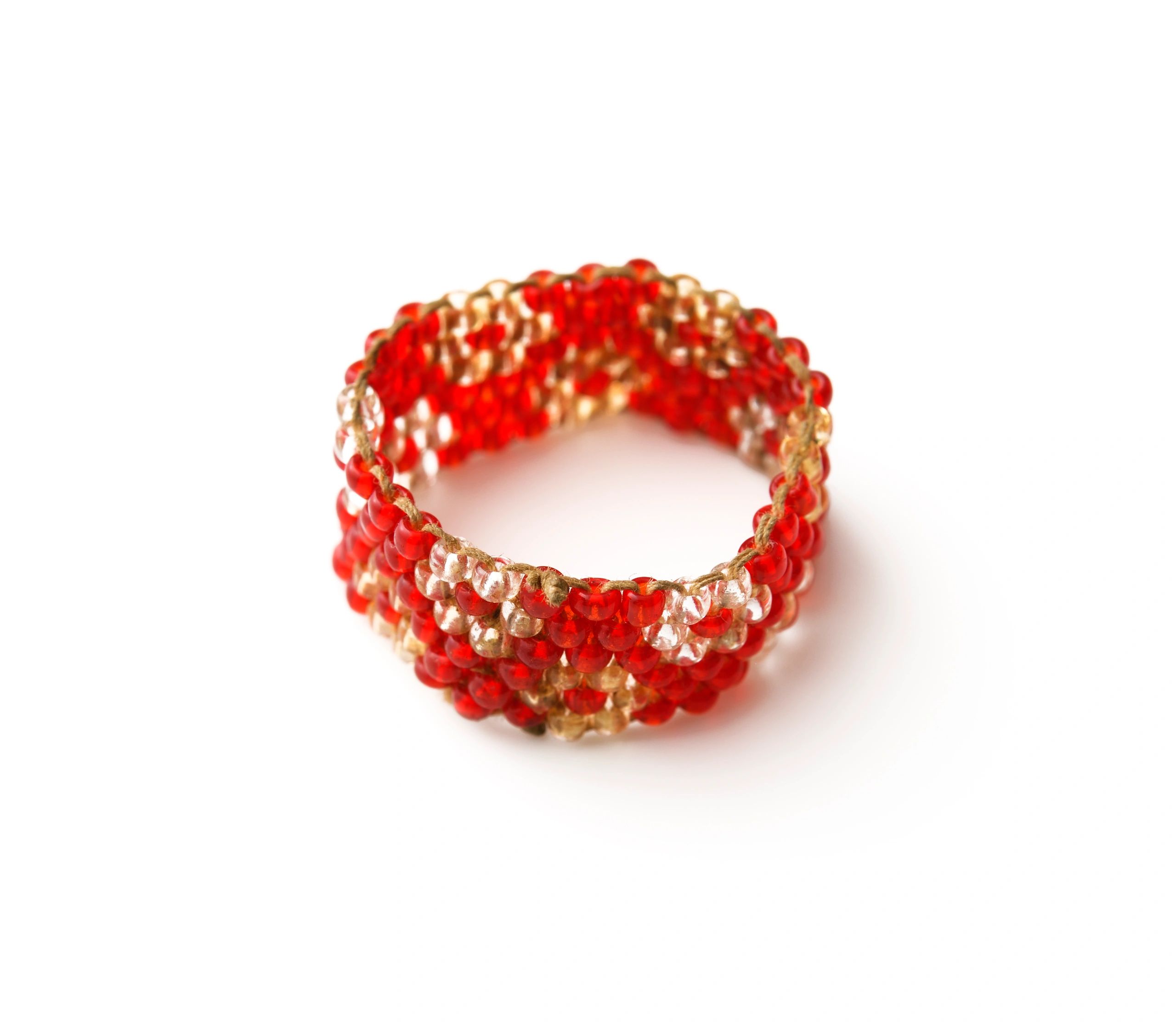 beaded ring on white background